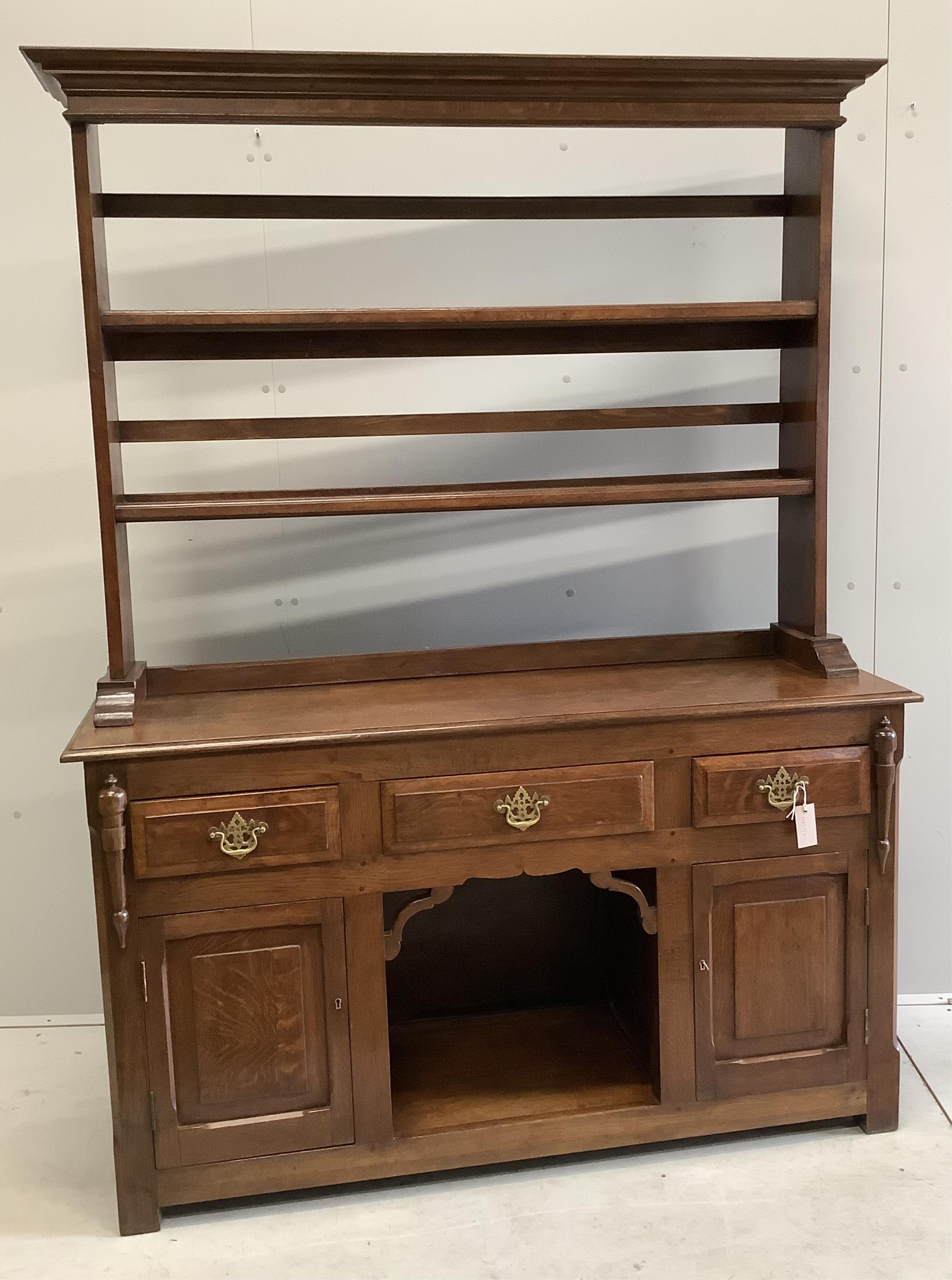 An 18th century style oak 'dog kennel' dresser, with boarded rack, width 138cm, depth 41cm, height 182cm. Condition - fair to good